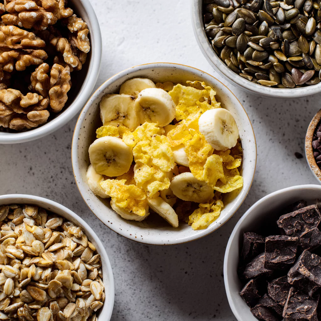 Close-up of labeled low FODMAP trail mix 缅甸性视频 in separate bowls