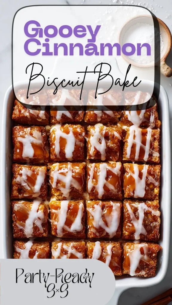 Overhead 9×9 gooey cinnamon roll biscuit casserole with cream-bytv跳转接口点击进入网页 pockets and vanilla glaze, one square removed on marble.