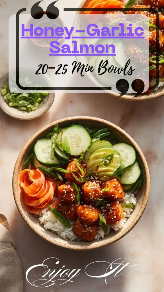 Top-down honey-garlic salmon bites bowl on white rice with cucumber, avocado, carrot ribbons, scallions and sesame seeds.