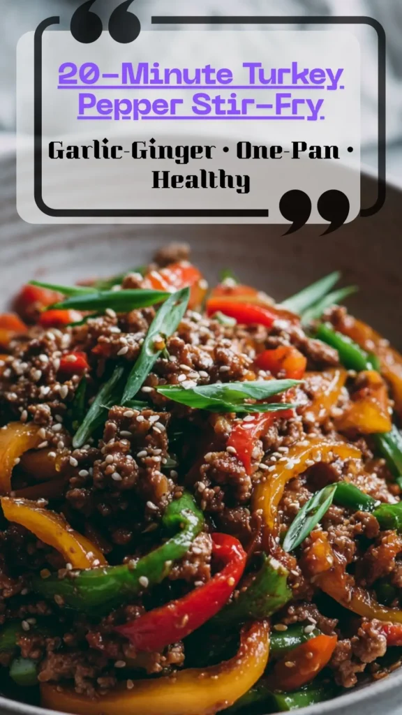 Skillet of ground turkey and rainbow bell peppers in glossy garlic-ginger sauce, topped with scallions and sesame; 20-minute stir-fry.
