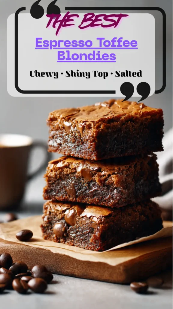 Stack of salted toffee espresso blondies with shiny crackly tops, melty chocolate pools, toffee bits, and flaky salt on parchment.